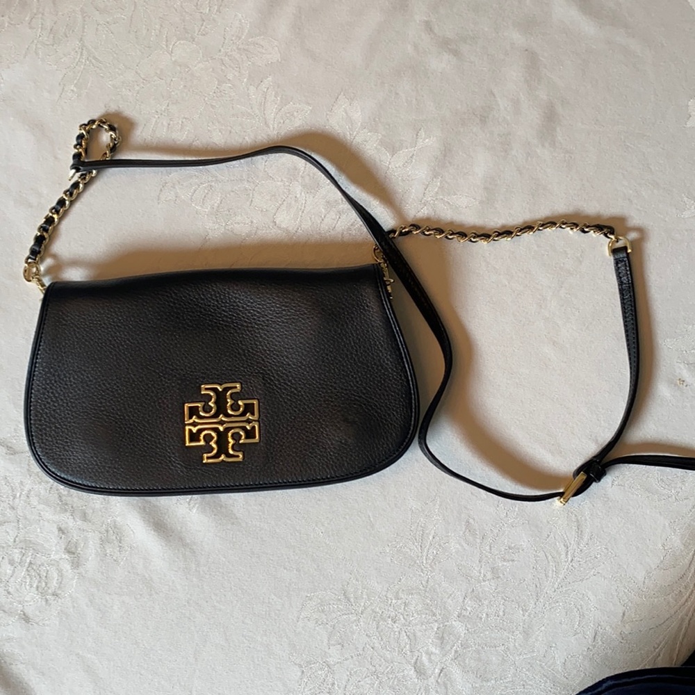 Tory Burch black leather crossbody with gold accents.